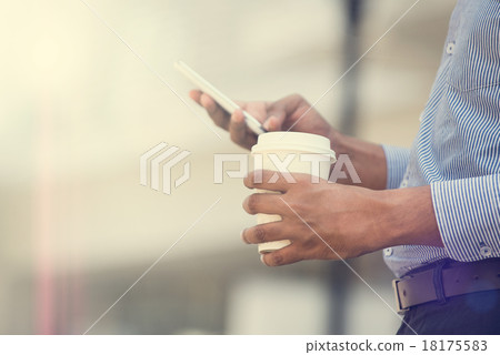 indian business man using phone and coffee  18175583