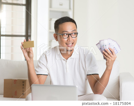 asian male enjoying cash back credit card asian male enjoying cash back credit card 18175804