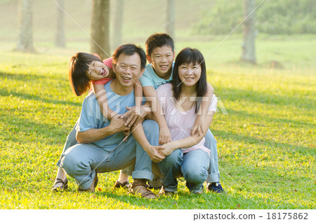 Family lying outdoors being playful and smiling, Outddor portrai 18175862