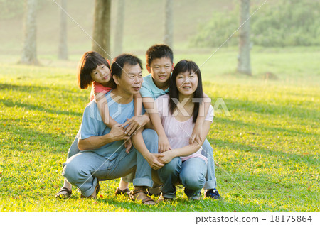 Family lying outdoors being playful and smiling, Outddor portrai 18175864