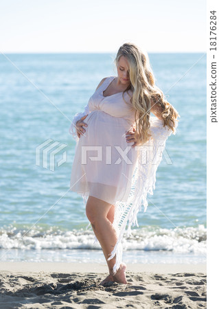 Portrait of beautiful pregnant woman over sea Portrait of beautiful pregnant woman over sea 18176284