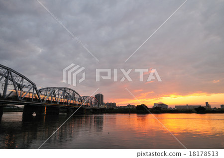 Keisei train crossing the Horikiriki bridge at sunset Keisei train crossing the Horikiriki bridge at sunset 18178513