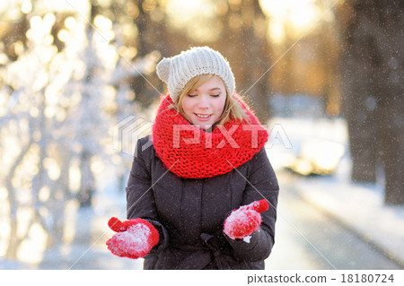 Young woman having fun in winter 18180724