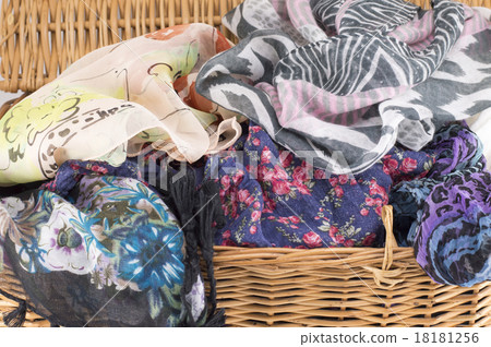 Woman scarf in a wooden basket Woman scarf in a wooden basket 18181256