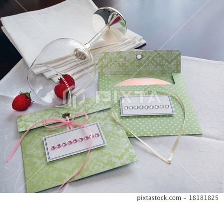 envelopes for disks. white napkins and wine glasse 18181825