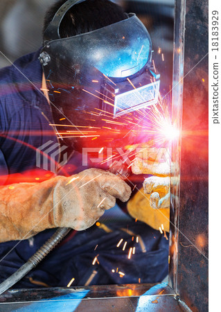 worker welding construction by MIG welding 18183929