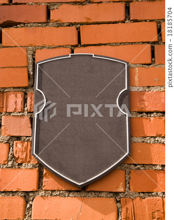 a plaque on the stone wall 18185704