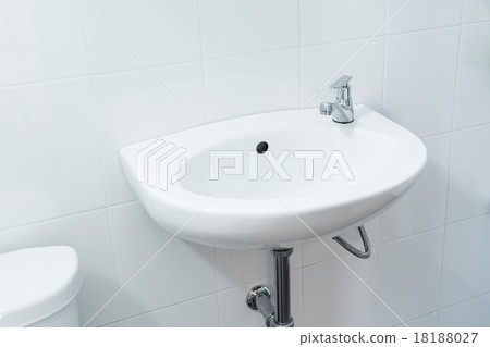 close up white basin on wall in bathroom close up white basin on wall in bathroom 18188027