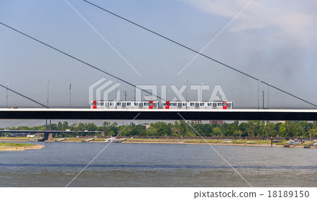 Tram mouving on Oberkasseler bridge in Dusseldorf 18189150