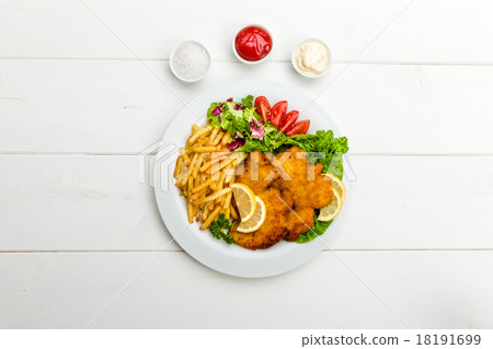 Chicken cutlets with fries and salad 18191699