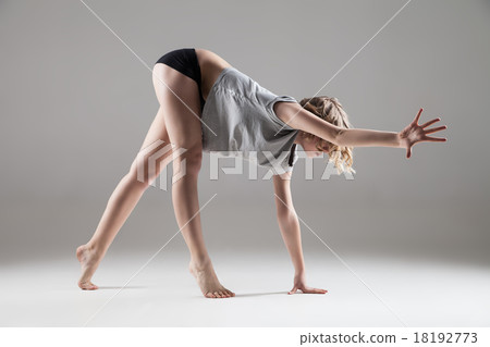 young beautiful woman in grey T-shirt and black 18192773