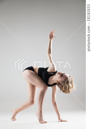 young beautiful woman in black T-shirt and shorts 18192833