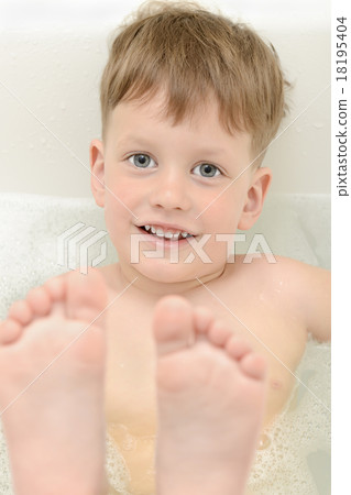 Cute three year old boy taking a bath with foam Cute three year old boy taking a bath with foam 18195404
