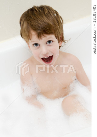 Cute three year old boy taking a bath with foam Cute three year old boy taking a bath with foam 18195405