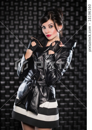Beautiful brunette posing in black jacket 18196160