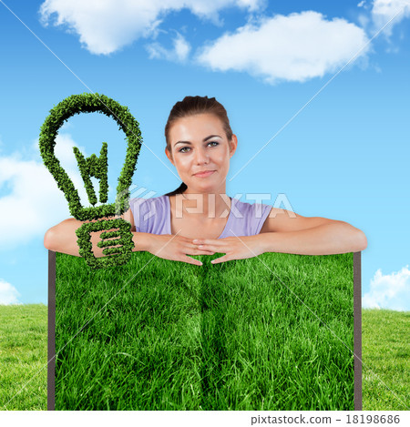 Composite image of woman with lawn book 18198686