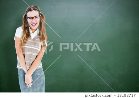 Composite image of smiling geeky hipster smiling at camera Composite image of smiling geeky hipster smiling at camera 18198717