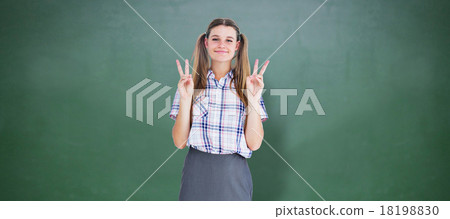Composite image of geeky hipster smiling at camera 18198830