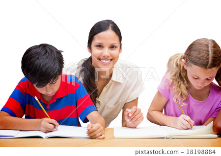 Composite image of pretty teacher helping pupils in library 18198884