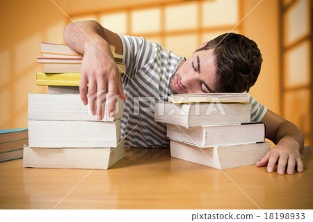 Composite image of student asleep in the library 18198933