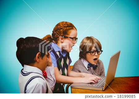 Composite image of pupils using laptop 18199085