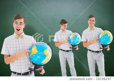 Composite image of nerd with globe 18199297