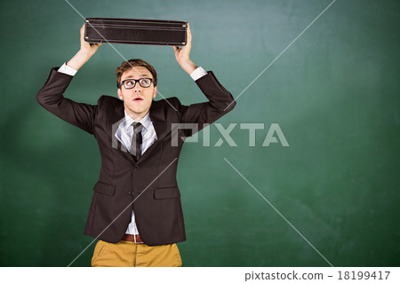 Composite image of young geeky businessman holding briefcase Composite image of young geeky businessman holding briefcase 18199417