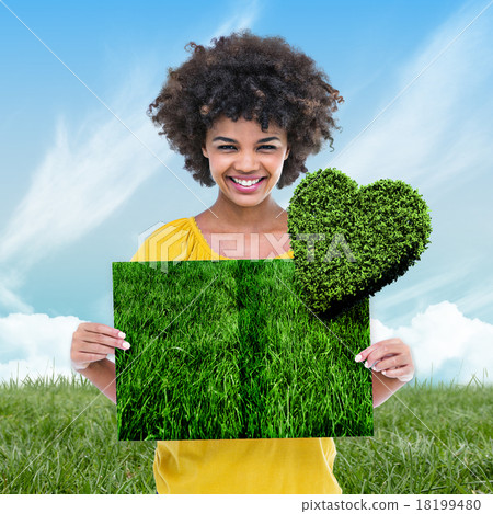 Composite image of woman holding lawn book Composite image of woman holding lawn book 18199480