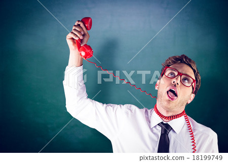 Composite image of geeky businessman strangling himself with tel 18199749