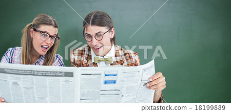 Composite image of geeky hipsters reading the newspaper Composite image of geeky hipsters reading the newspaper 18199889