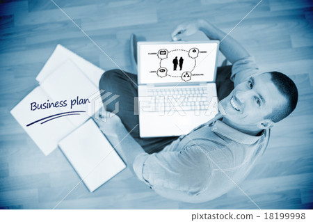 Business plan against young creative businessman working on lapt 18199998