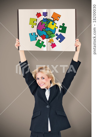 Composite image of businesswoman showing a book 18200030