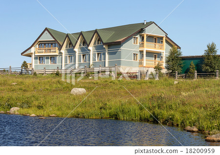 New small hotel on the lake bank in summer 18200959