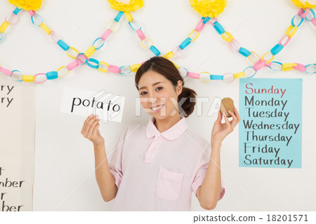 Teacher of an infant English classroom 18201571