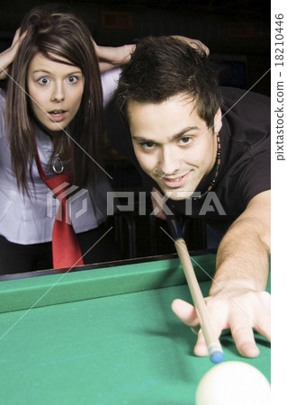 Man playing snooker in the dark club. 18210446