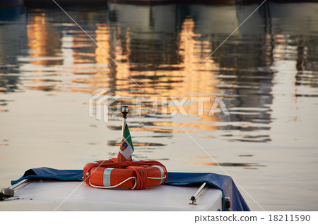 Red life buoy on nose of old boat Red life buoy on nose of old boat 18211590