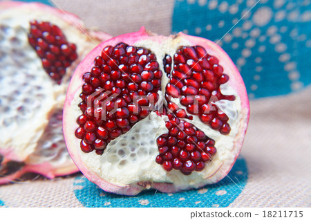 Half a large red pomegranate Half a large red pomegranate 18211715