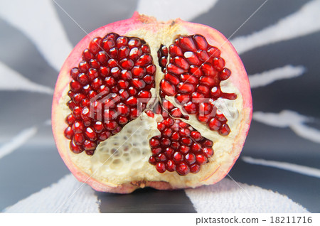 Half a large red pomegranate Half a large red pomegranate 18211716