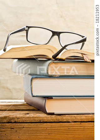 books with glasses 18211953