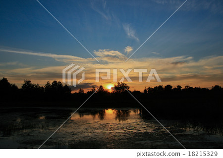 sunset over lake 18215329