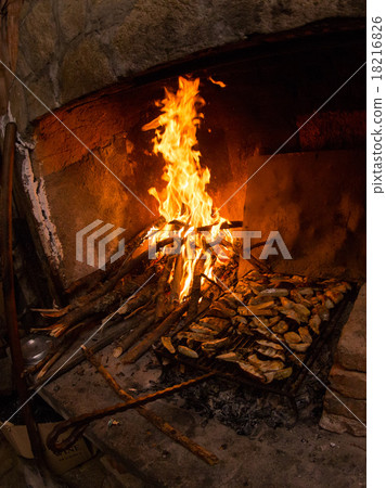 Roasting of porcini mushrooms on coals in oven  18216826