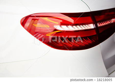 Detail on the rear light of a car Detail on the rear light of a car 18218005