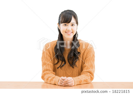 White back pose of a teenage woman sitting wearing a sweater 18221815
