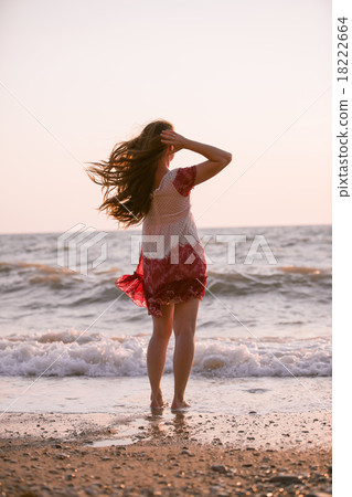 Woman with long hair on the beach Woman with long hair on the beach 18222664