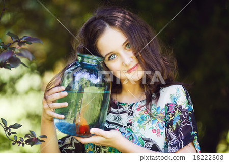 Young beautiful girl with gold fish Young beautiful girl with gold fish 18222808