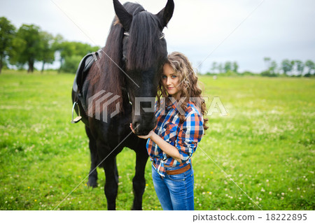 Young beautiful girl with frisian horse Young beautiful girl with frisian horse 18222895