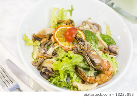 seafood salad on a plate on a white background seafood salad on a plate on a white background 18223898