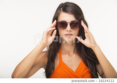 Nice lady in orange shirt is looking deep. 18224112