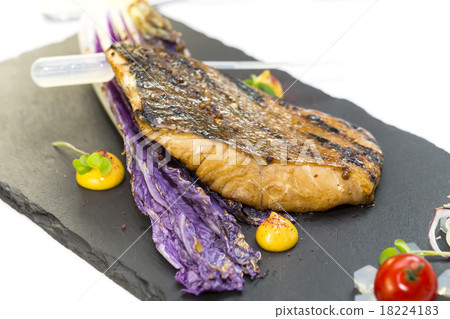 Baked salmon fillet on hot volcanic stones Baked salmon fillet on hot volcanic stones 18224183