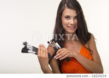 Glamur lady is showing cosmetic brush set. 18224214